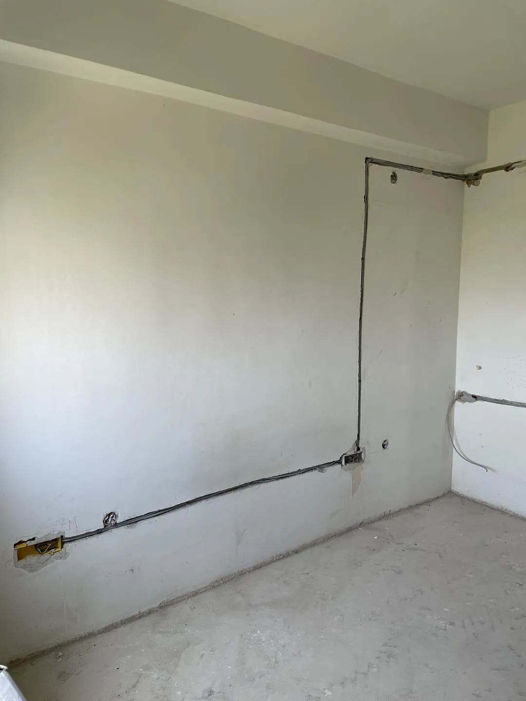 New electrical wiring chased into a wall during construction