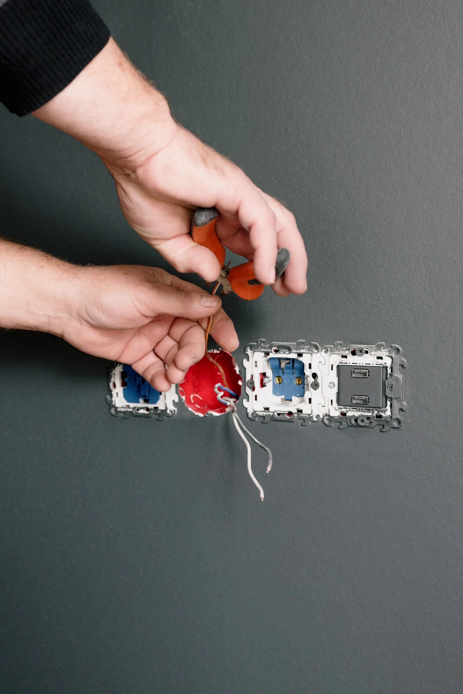 Replacing old sockets and switches in a wall