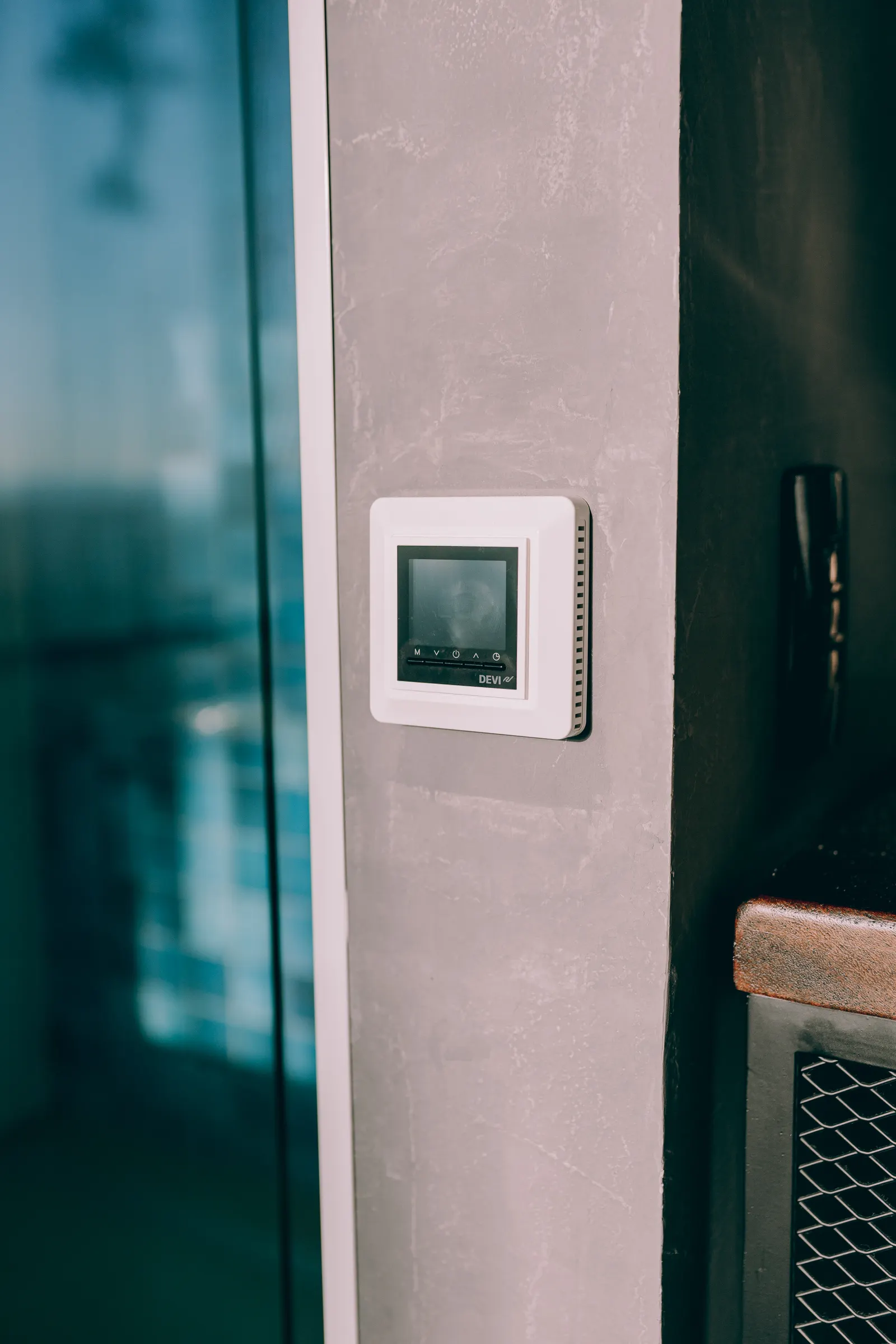 Smart thermostat mounted on a wall